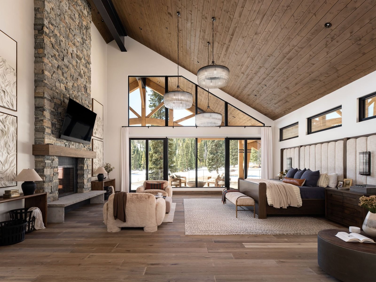 Great room with fog-shrouded mountain photography and stone fireplace