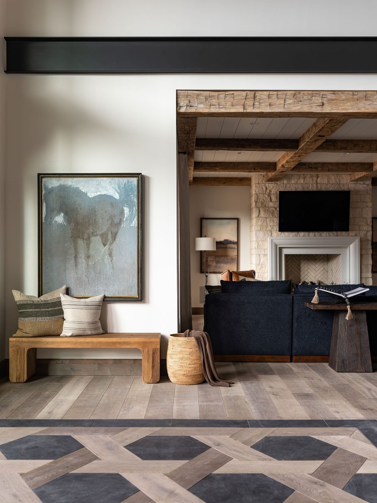 Black-framed glass cabinet styled with ceramics and books