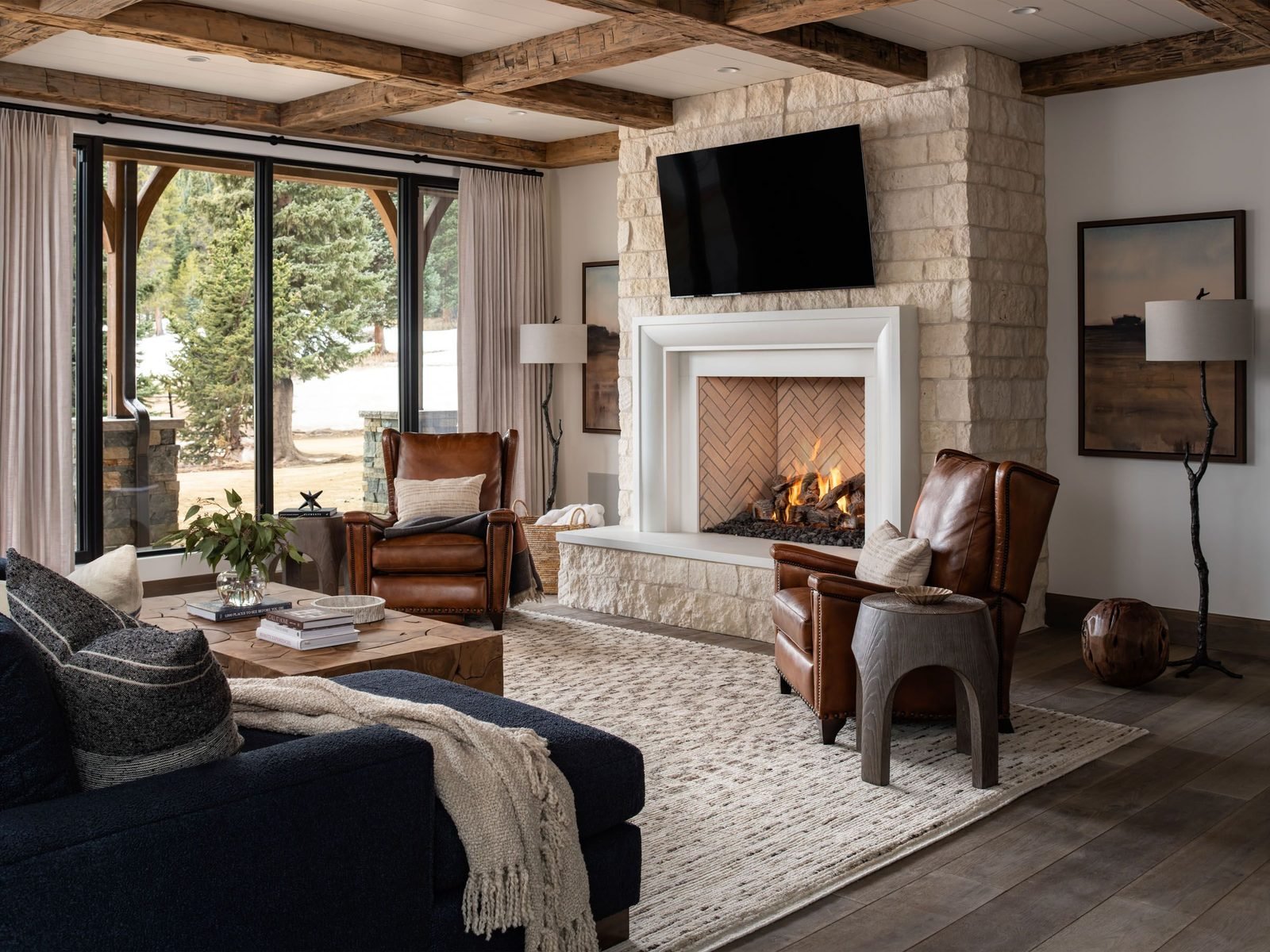 Living room with stone fireplace and navy sectional