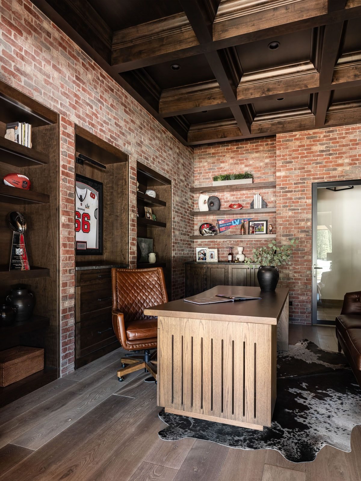 Walk-in closet with exposed brick wall