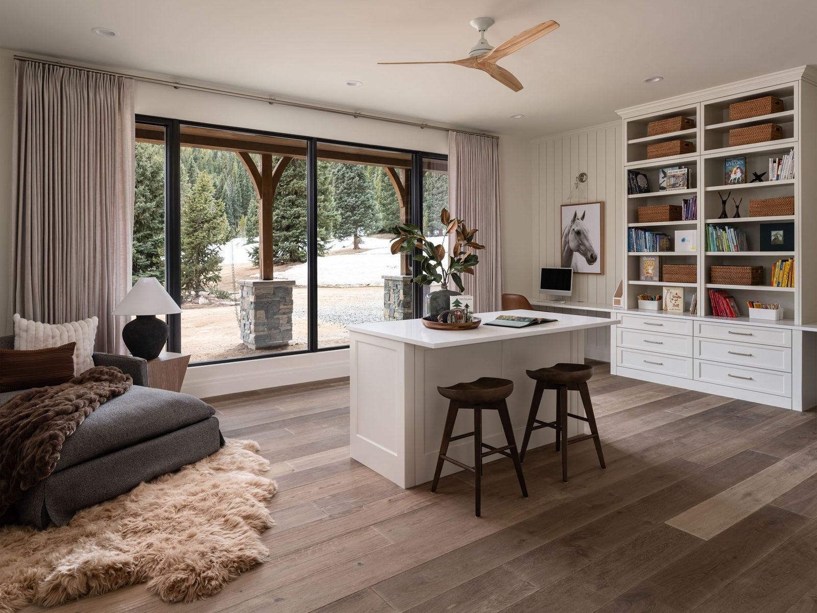 Kids study room with island desk and built-in bookshelves