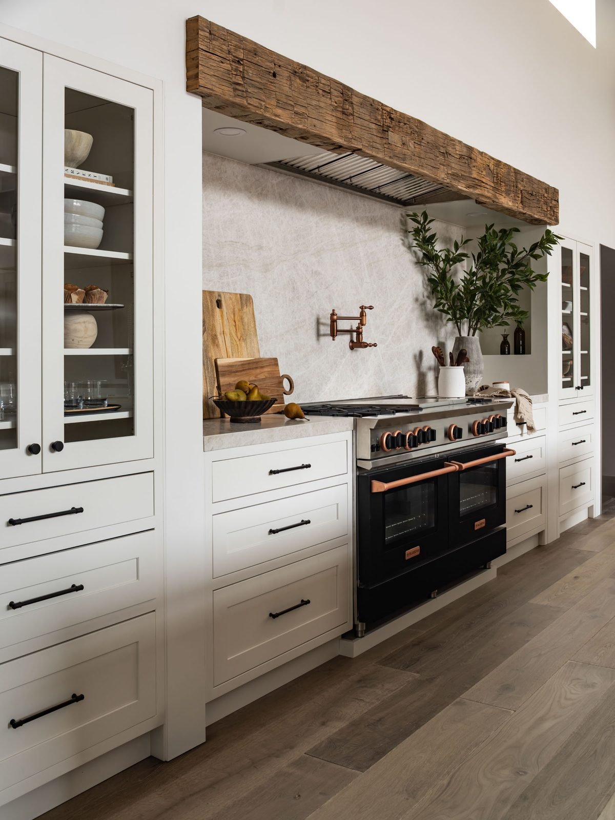 Kitchen range wall with reclaimed wood beam