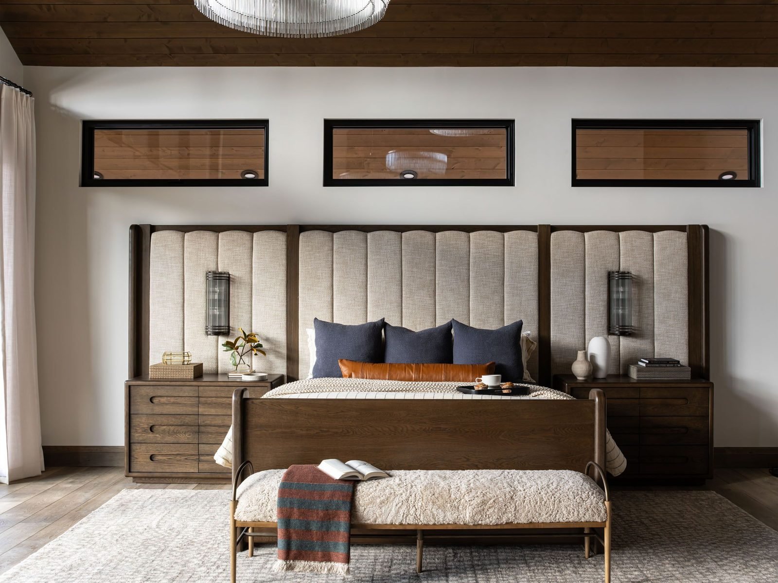 Primary bedroom with upholstered headboard