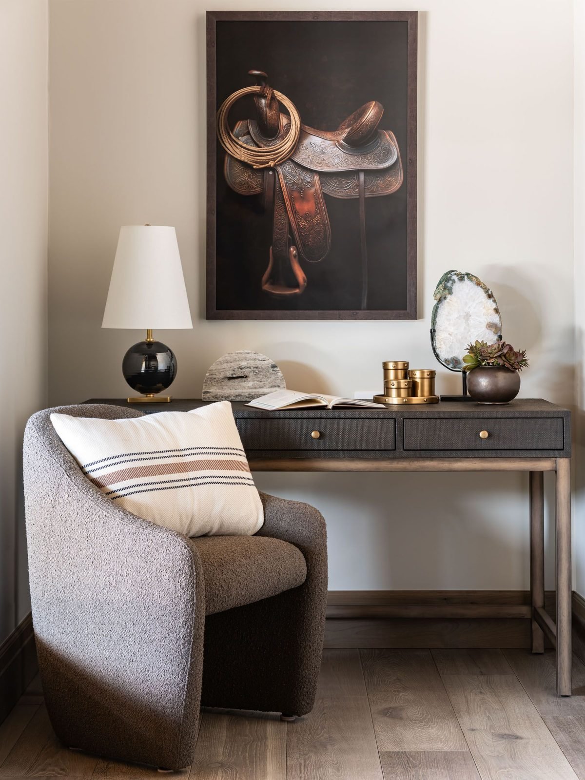 Reading nook with framed saddle artwork